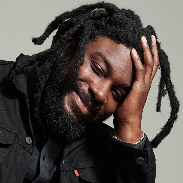 Jason Reynolds, a Black man with thick dreadlocks and a beard. Clicking the image leads you to his profile.
