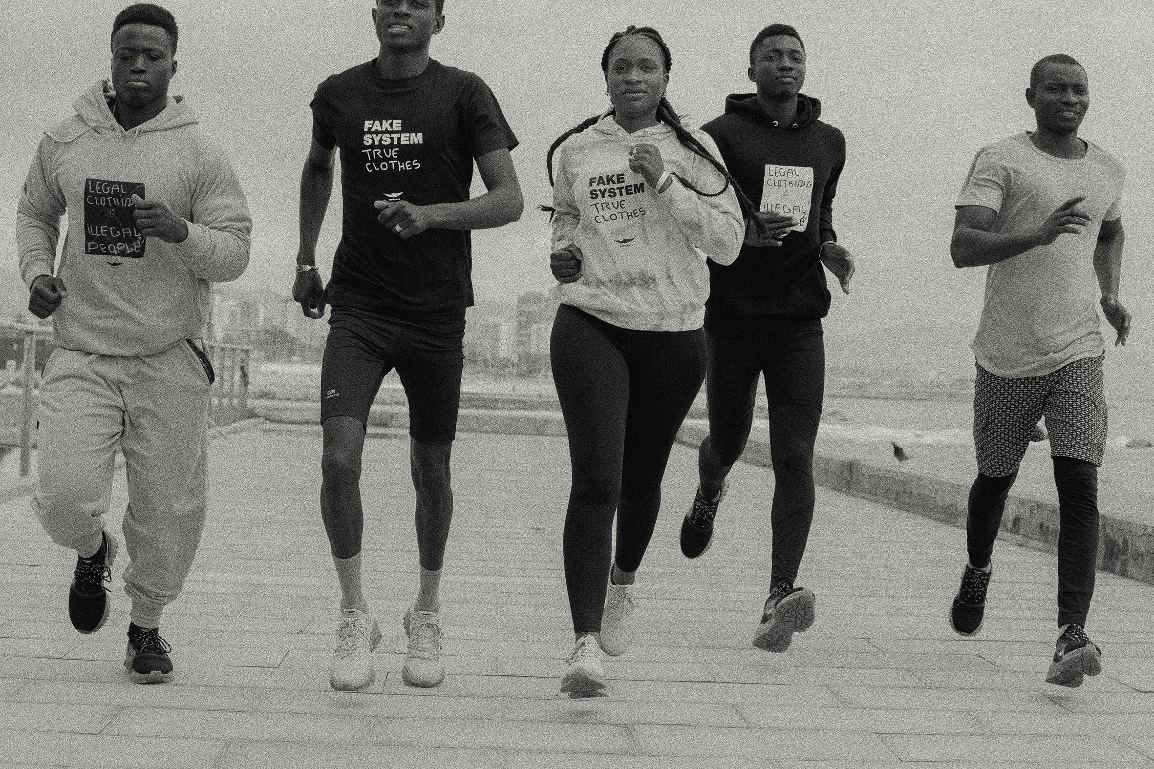 Five Black athletes wearing Top Mantas gear run alongside each other
