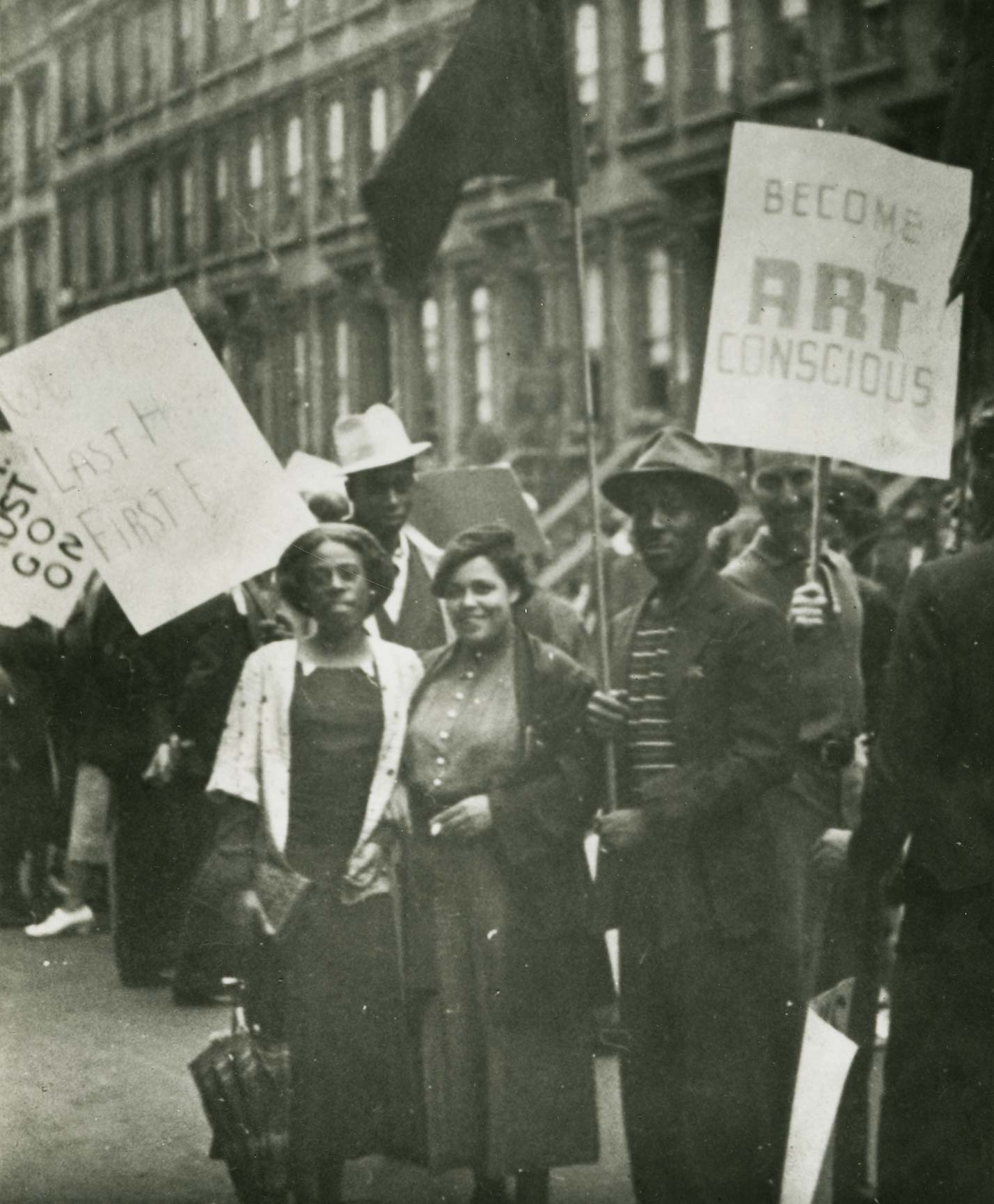 Members of the Harlem Artists Guild picketing with the Works Progress Administration Artists Union to protest cutbacks to WPA programs. Gwendolyn Bennett (center), Norman Lewis (right), and Frederick Perry (wearing the white hat). Harry Henderson Papers, 