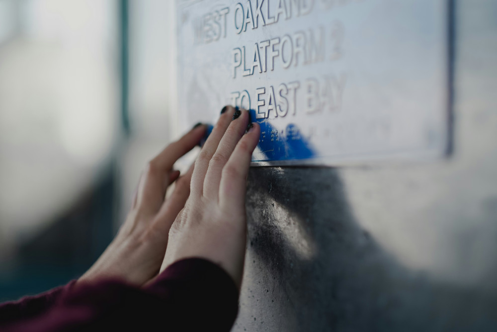 Braille sign at a Bay Area Rapid Transit station. (Photo by Levi Meir Clancy / Unsplash)