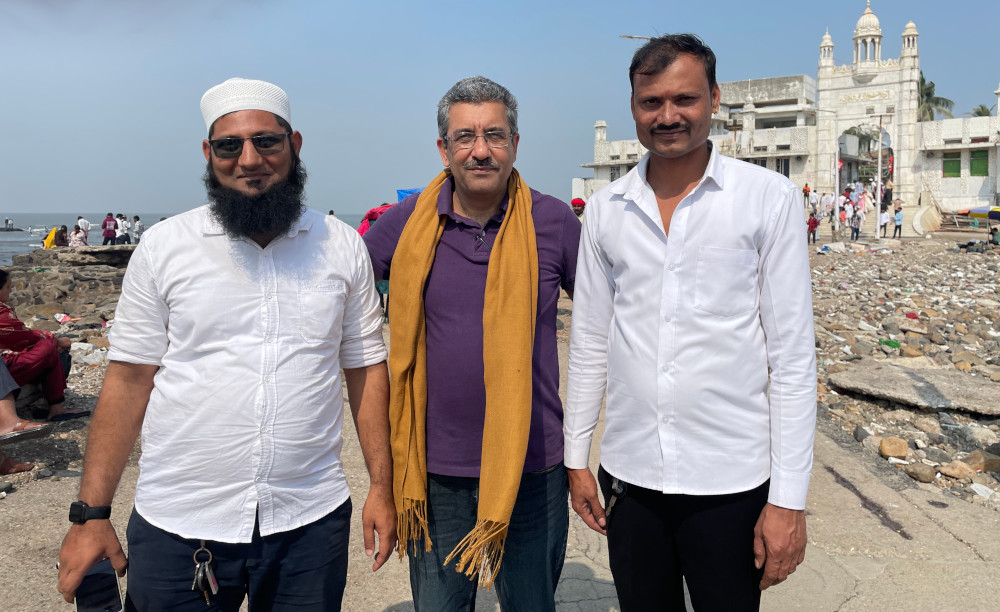 Samir (center) poses for a photo with his taxi drivers who drove him from Pune to Mumbai, a 200km drive