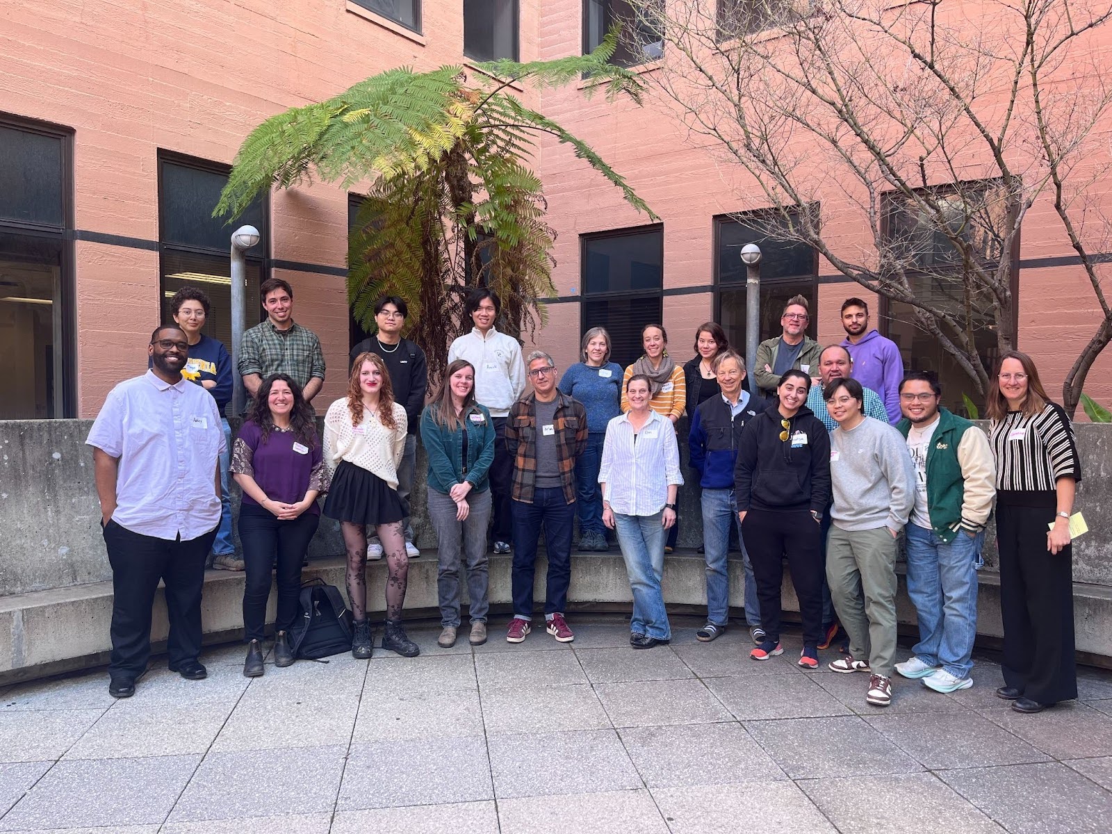 Faculty members and students pose for a group photo