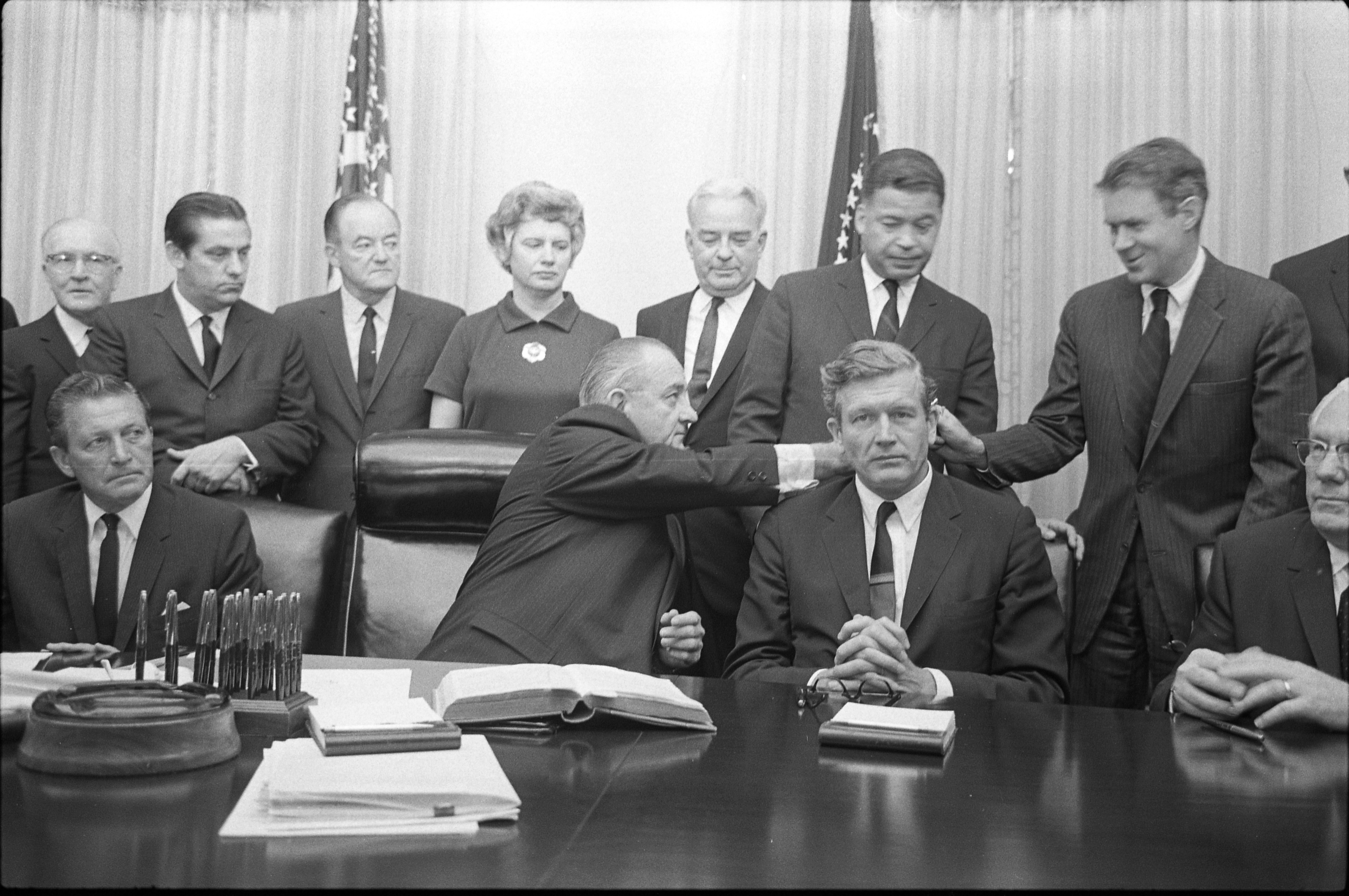 Black and white photo of President Lyndon Baines Johnson with some members of the National Advisory Commission on Civil Disorders (Kerner Commission) in the Cabinet Room of the White House, Washington, D.C.