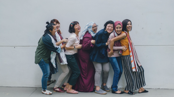 This image is of a group of women laughing. 