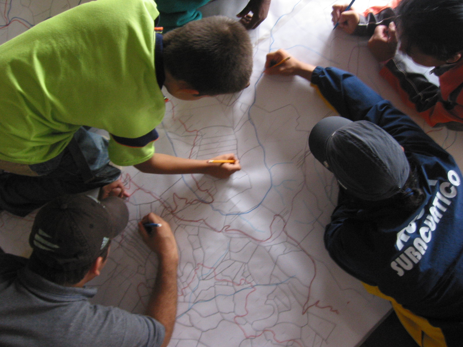 Children drawing on a map