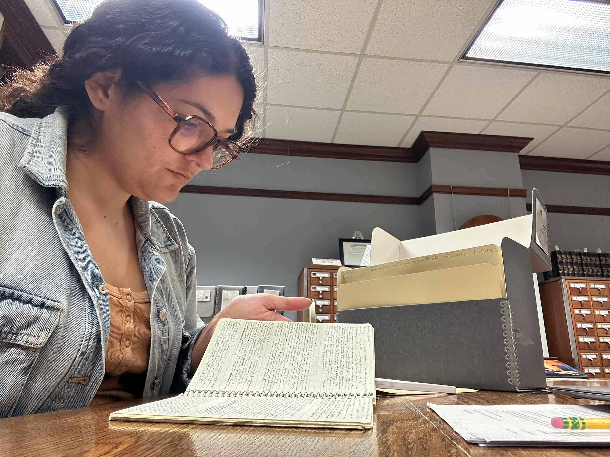 Ashley Gallegos reading bell hooks' notebook
