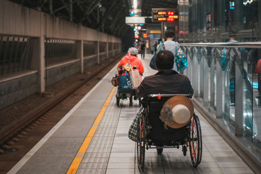 Wheelchair riders on a train station platform in Taichung, Taiwan. (Photo by Lisanto / UnSplash)