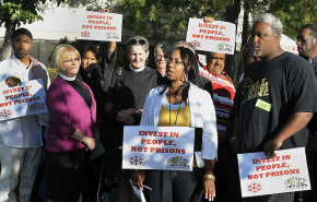 This picture is of. Safe Return members and supporters speak at a press conference about the proposed jail expansion in Contra Costa County in 2012