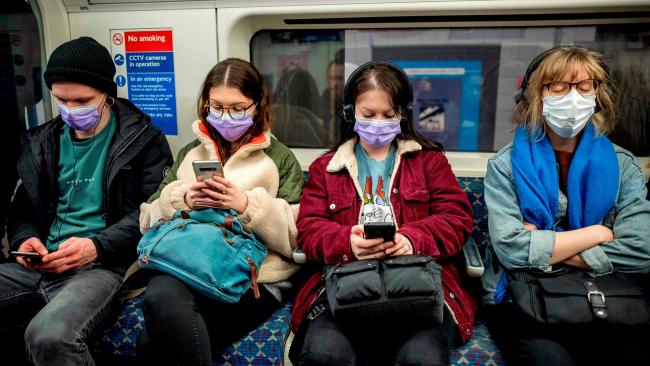 Photo showing masked people on a subway train